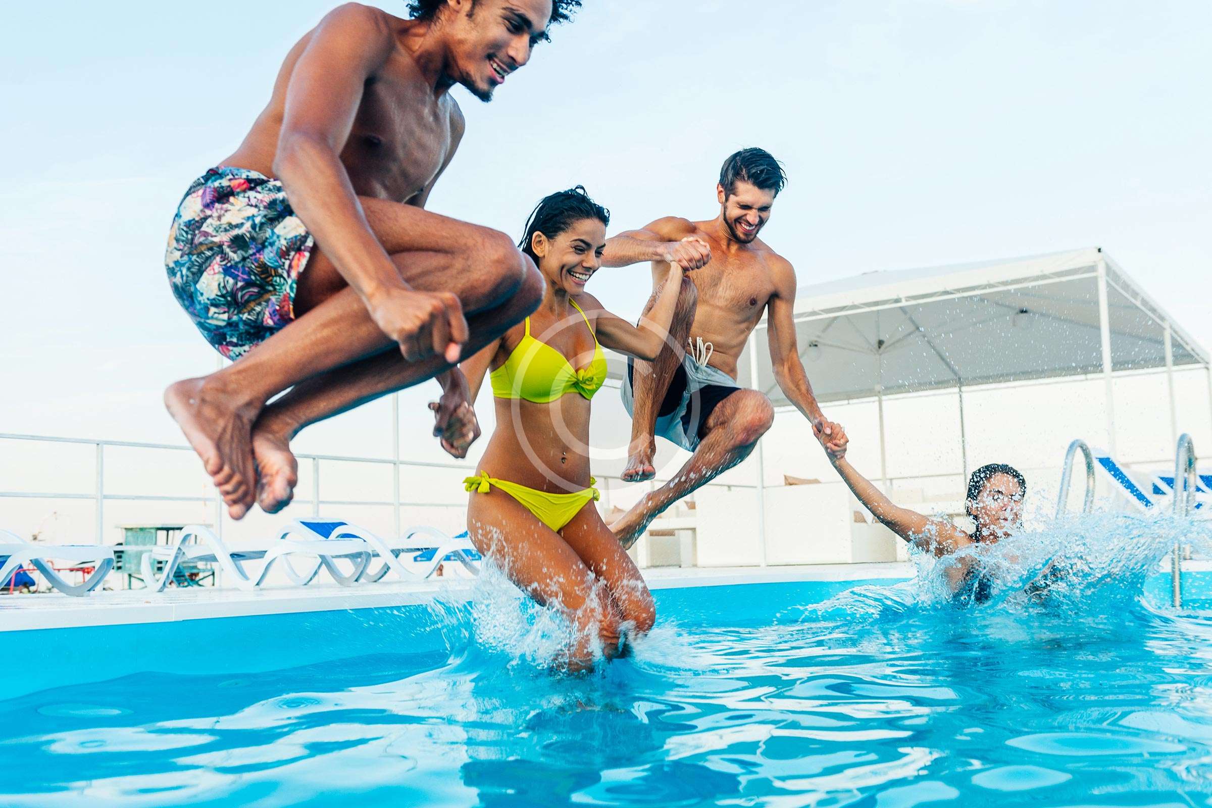 Four people are enjoying together, into pool